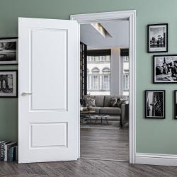 Open fire door with mint coloured walls and lots of picture frames surrounding it