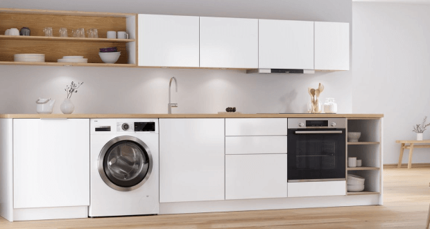 white modern kitchen with freestanding washing machine