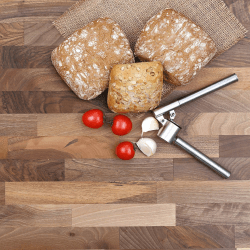 wooden worktop with bread and vegetables